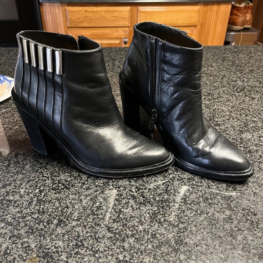 ankle boots. Black leather ,well made beautifully detailed with silverside zip.